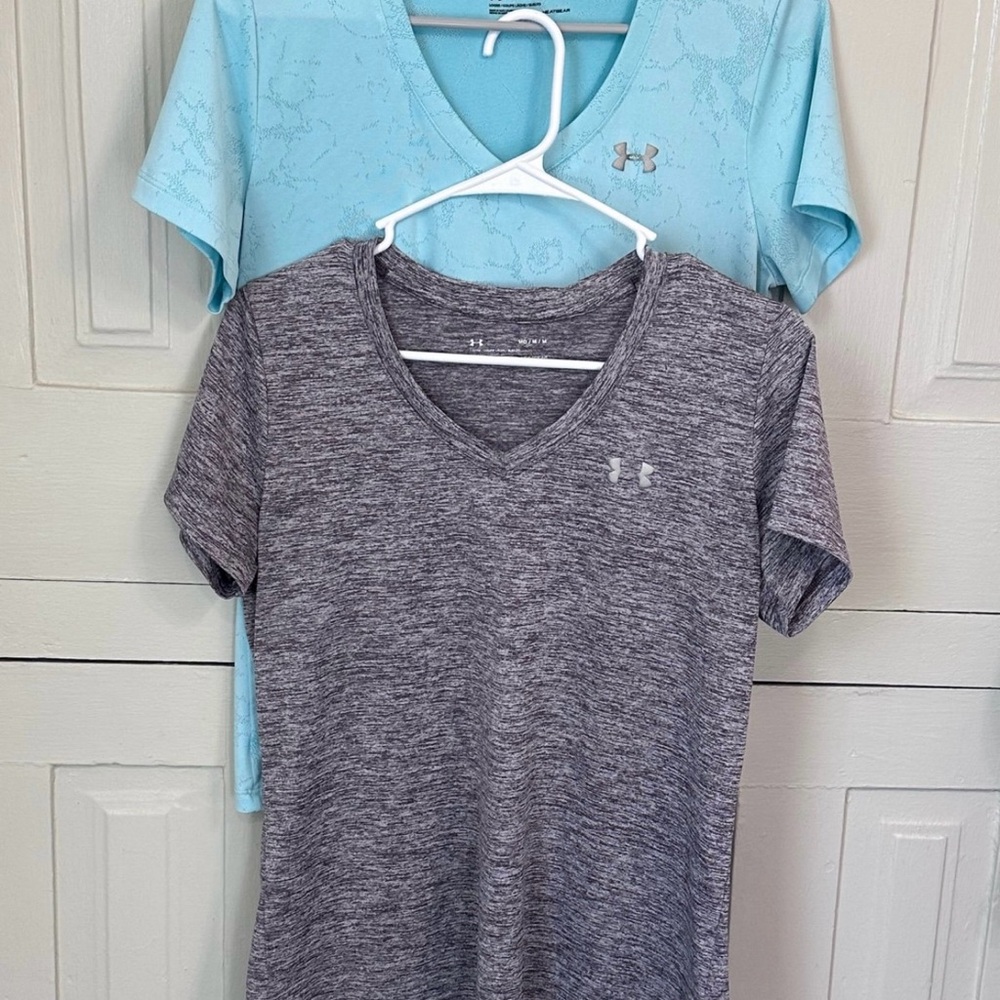 Bundle of two women’s Under Armour short sleeved shirts.